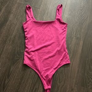 Pink body suit